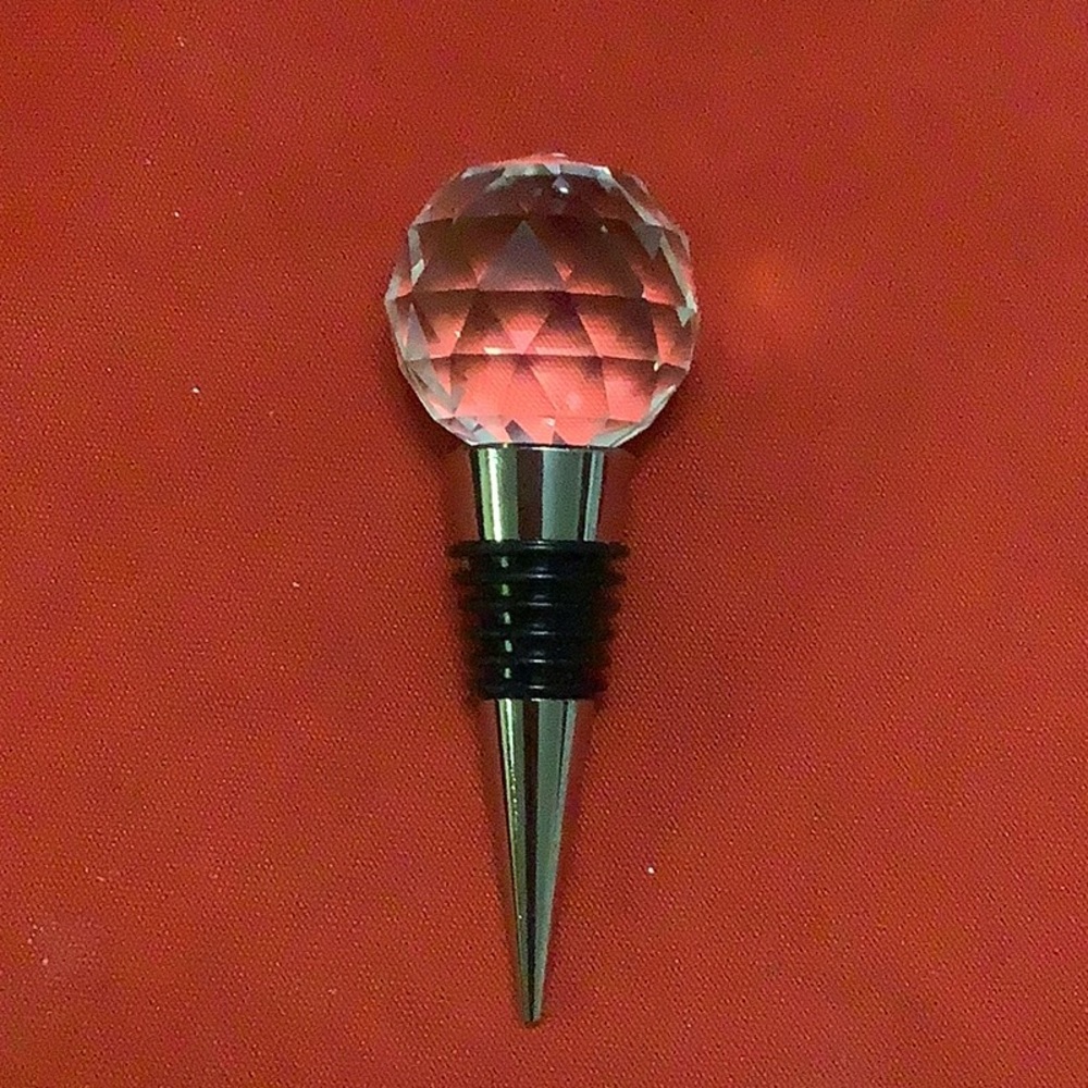 Cristal like wine finial has a black Ring around the middle . Made. By Durand.